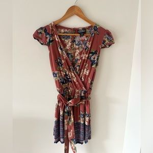 Angie Floral Romper Plunged short sleeves with blue floral print